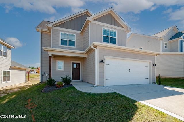 view of front of property with a garage and a front yard