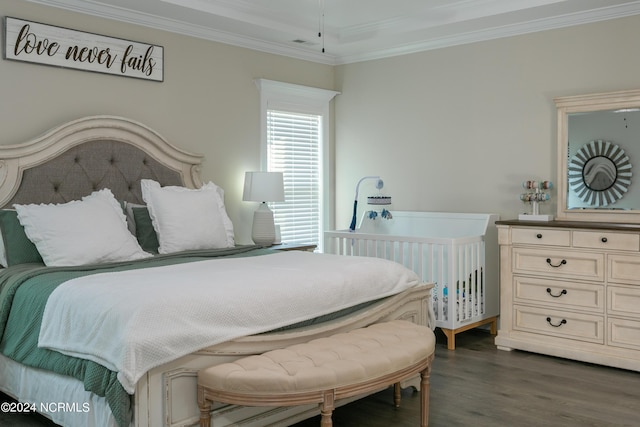 bedroom featuring ornamental molding and dark hardwood / wood-style floors