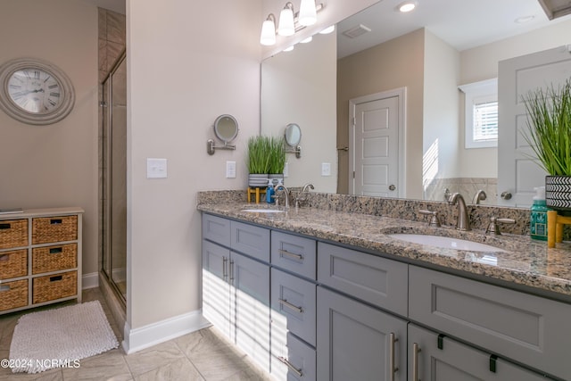 bathroom featuring vanity and an enclosed shower