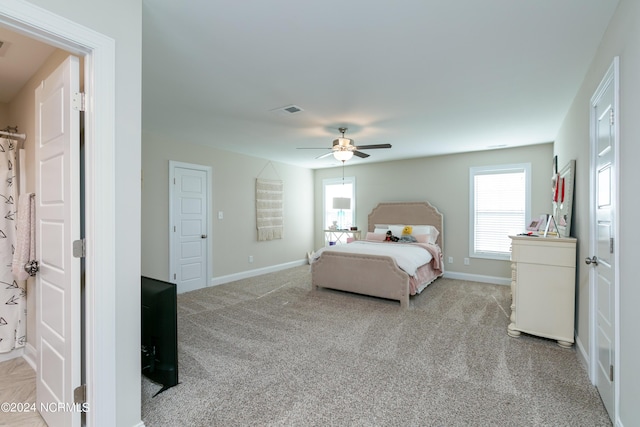 carpeted bedroom with ceiling fan