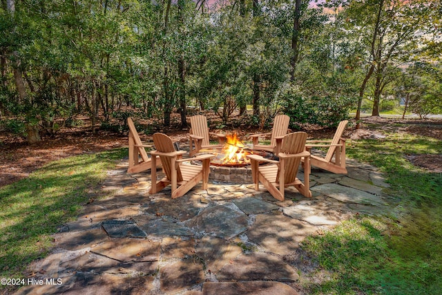 view of patio / terrace with an outdoor fire pit