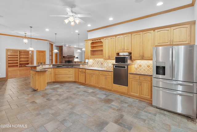 kitchen with kitchen peninsula, appliances with stainless steel finishes, hanging light fixtures, and ceiling fan