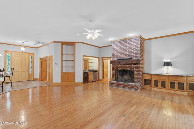 spare room featuring ornamental molding, french doors, ceiling fan, and light wood-type flooring