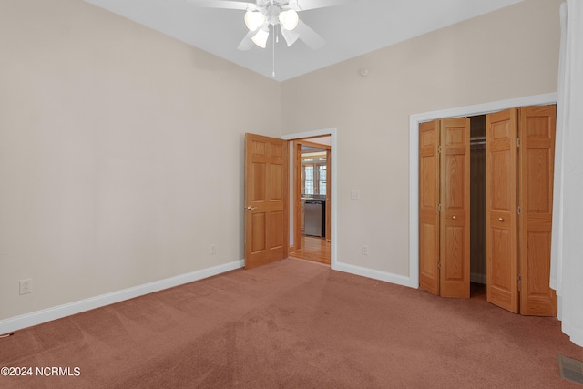 unfurnished bedroom featuring visible vents, light colored carpet, baseboards, and a closet