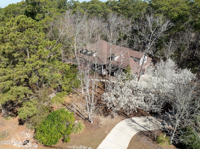 aerial view featuring a wooded view