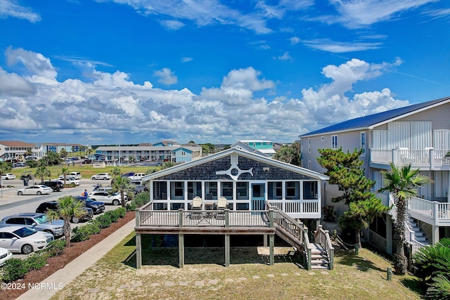 back of house featuring a deck