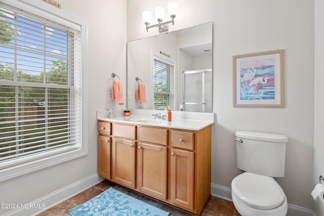 bathroom featuring a shower with door, toilet, tile patterned flooring, and vanity