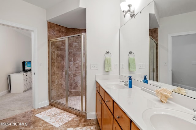 bathroom with walk in shower, tile patterned floors, and vanity