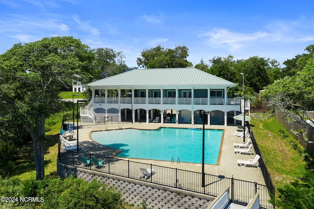 view of pool featuring a patio