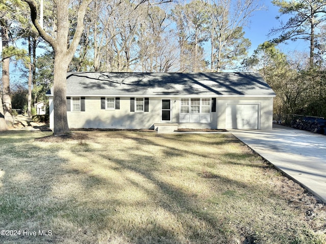 single story home featuring a front yard and a garage