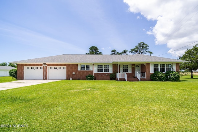 single story home featuring a garage and a front lawn