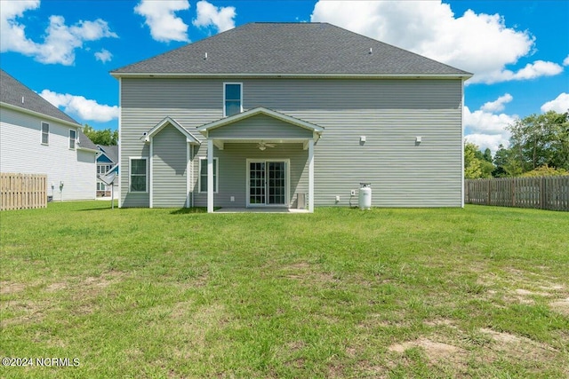 back of house with a yard