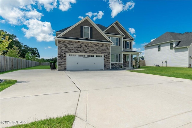 view of front of property with a garage and a front lawn