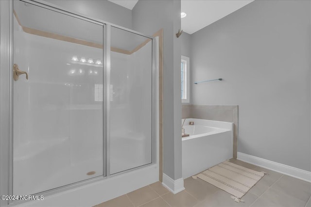 bathroom featuring tile patterned floors and plus walk in shower