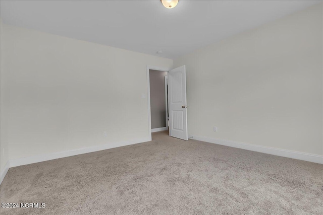 spare room featuring carpet flooring