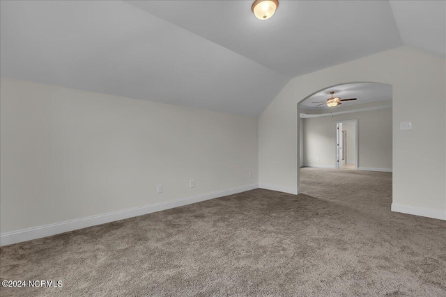 additional living space with carpet flooring, vaulted ceiling, and ceiling fan