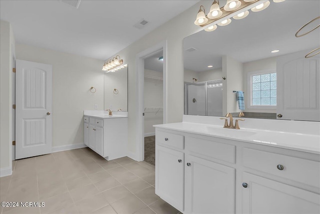 bathroom featuring dual vanity and tile patterned floors