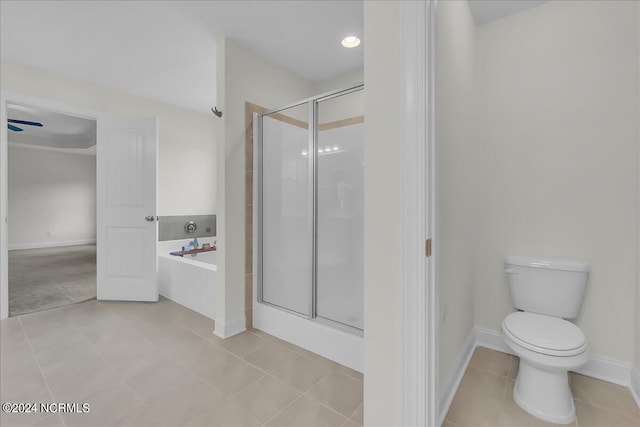 bathroom featuring tile patterned flooring, ceiling fan, toilet, and separate shower and tub