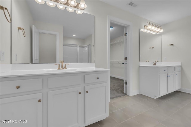 bathroom featuring vanity and tile patterned flooring