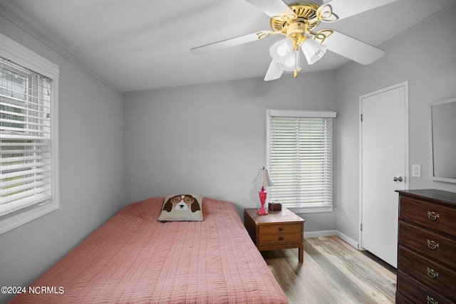 bedroom featuring a ceiling fan and light wood-style floors