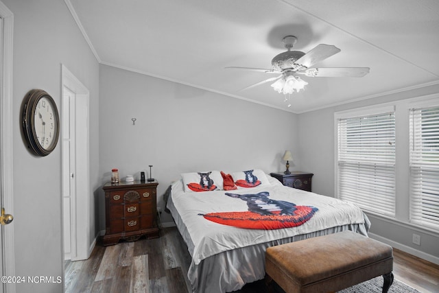 bedroom with crown molding, baseboards, ceiling fan, and wood finished floors