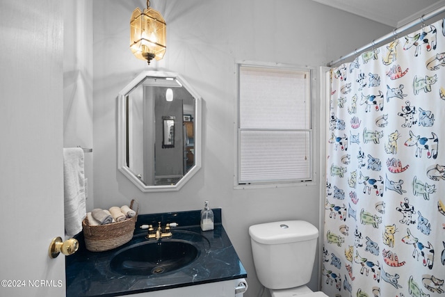 bathroom with a shower with shower curtain, vanity, and toilet