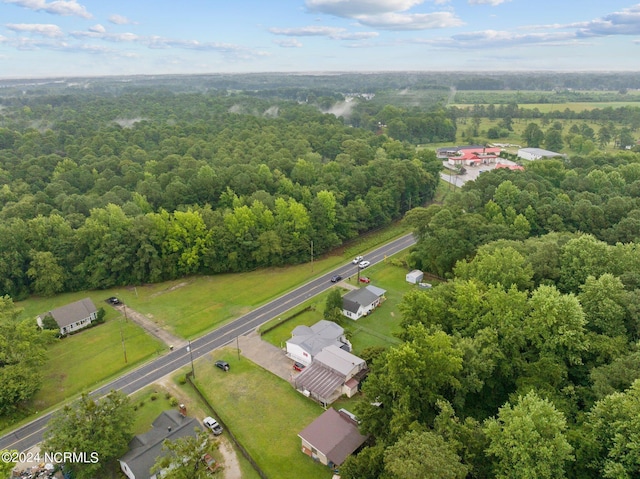 bird's eye view featuring a wooded view