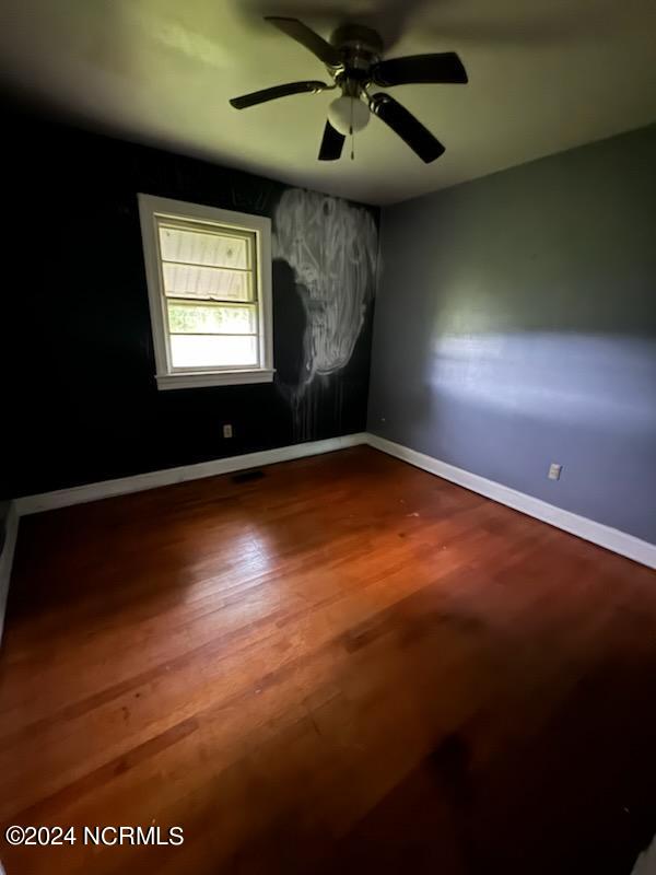 spare room featuring hardwood / wood-style flooring