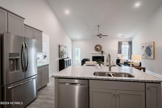 kitchen featuring appliances with stainless steel finishes, sink, and gray cabinetry