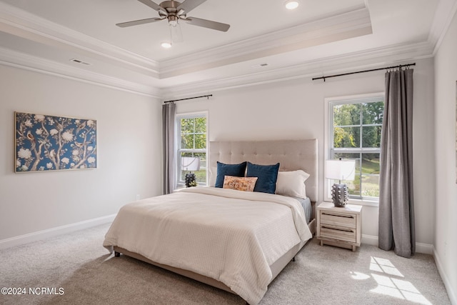 bedroom featuring light carpet, crown molding, multiple windows, and ceiling fan