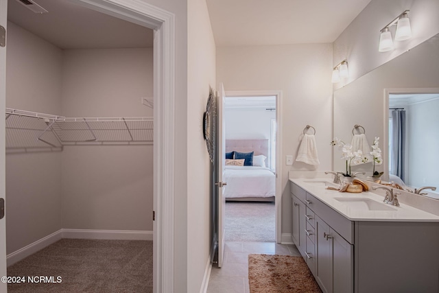 bathroom featuring tile patterned floors and vanity