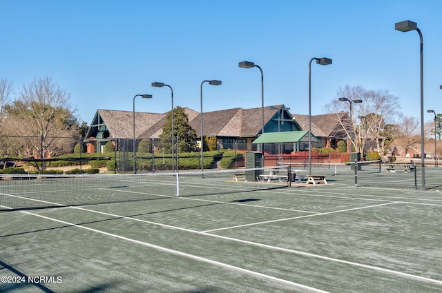 view of tennis court with fence