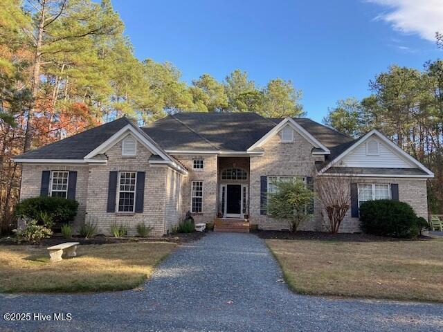 view of front of property with a front lawn