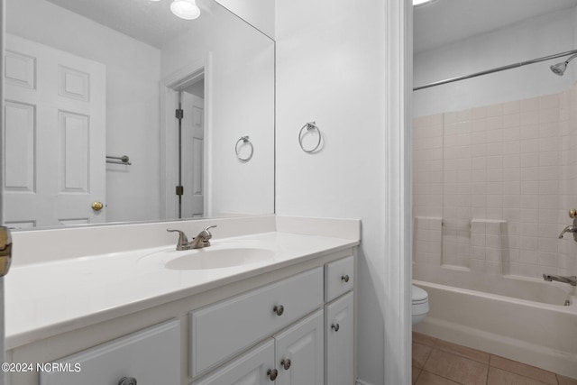 full bathroom with toilet, vanity, shower / bath combination, and tile patterned floors