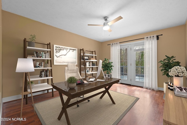 office with a textured ceiling, dark hardwood / wood-style flooring, and ceiling fan