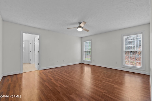 unfurnished room with hardwood / wood-style floors, a textured ceiling, and ceiling fan