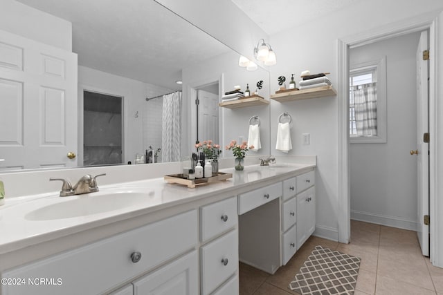 bathroom featuring a shower with curtain, vanity, and tile patterned floors