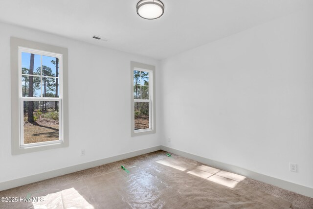 doorway to outside with a wainscoted wall, crown molding, and light wood-style floors