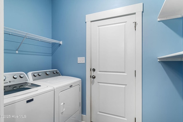 laundry room with separate washer and dryer