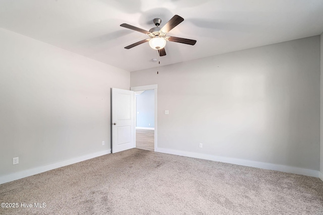 carpeted empty room featuring ceiling fan