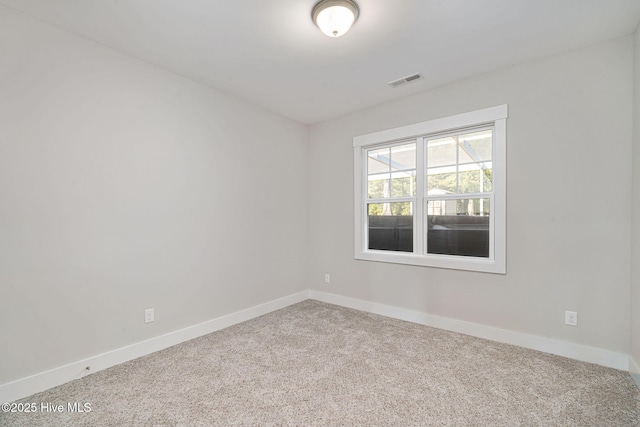 unfurnished room featuring carpet