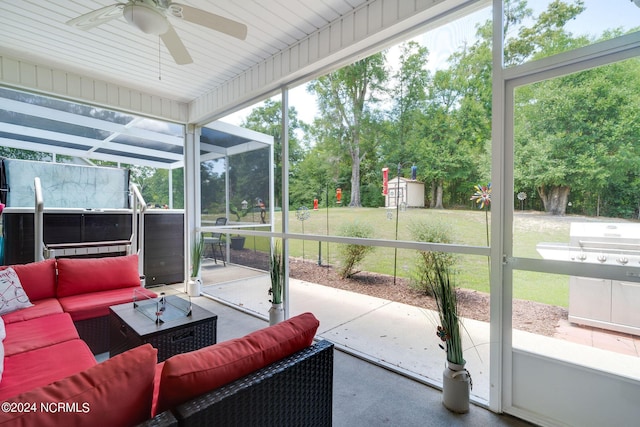 sunroom with ceiling fan and plenty of natural light