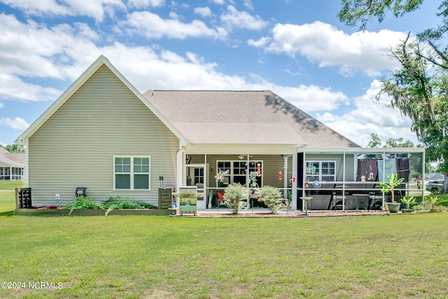 back of house featuring a lawn