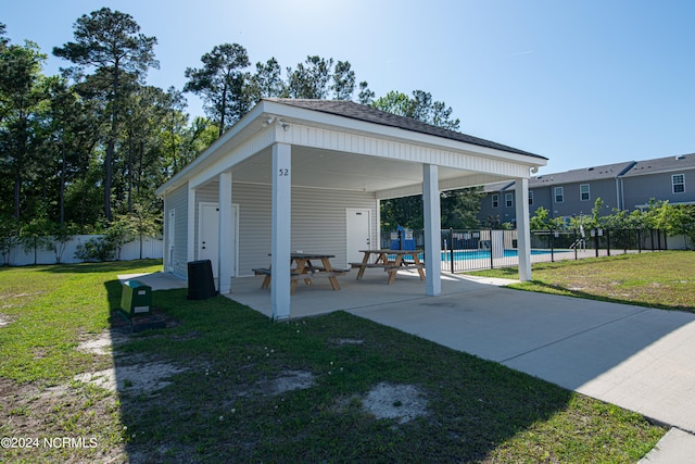 view of patio with a gazebo and a fenced in pool