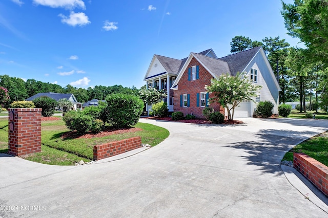 view of side of home with a garage and a yard