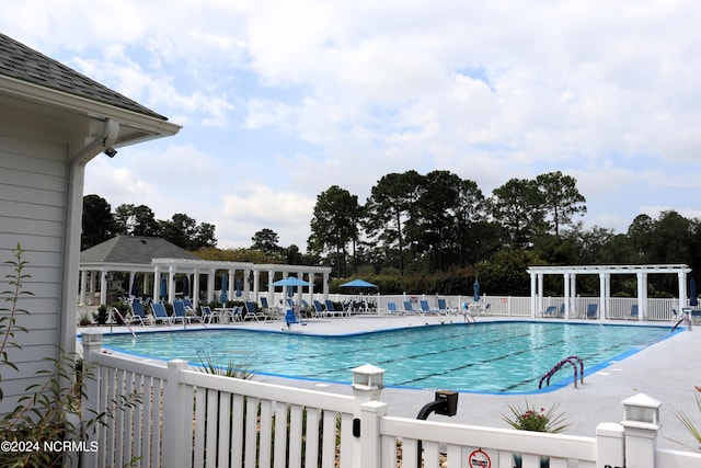 view of swimming pool featuring a patio area