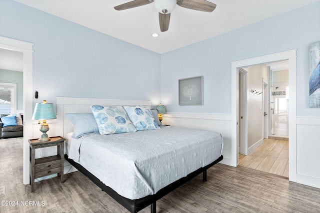 445 E Third St, Ocean Isle Beach, NC 28469 - bedroom featuring wood finished floors and ceiling fan