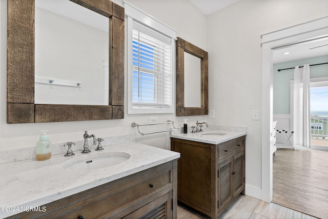 445 E Third St, Ocean Isle Beach, NC 28469 - bathroom featuring two vanities and wood finished floors