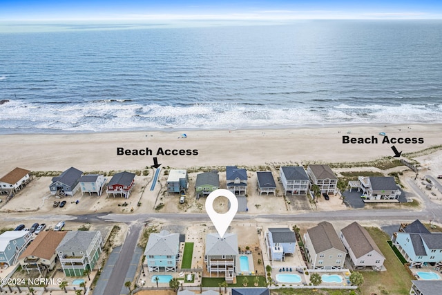 birds eye view of property with a residential view and a beach view