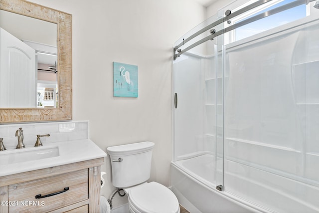 445 E Third St, Ocean Isle Beach, NC 28469 - bathroom with healthy amount of natural light, vanity, toilet, and combined bath / shower with glass door